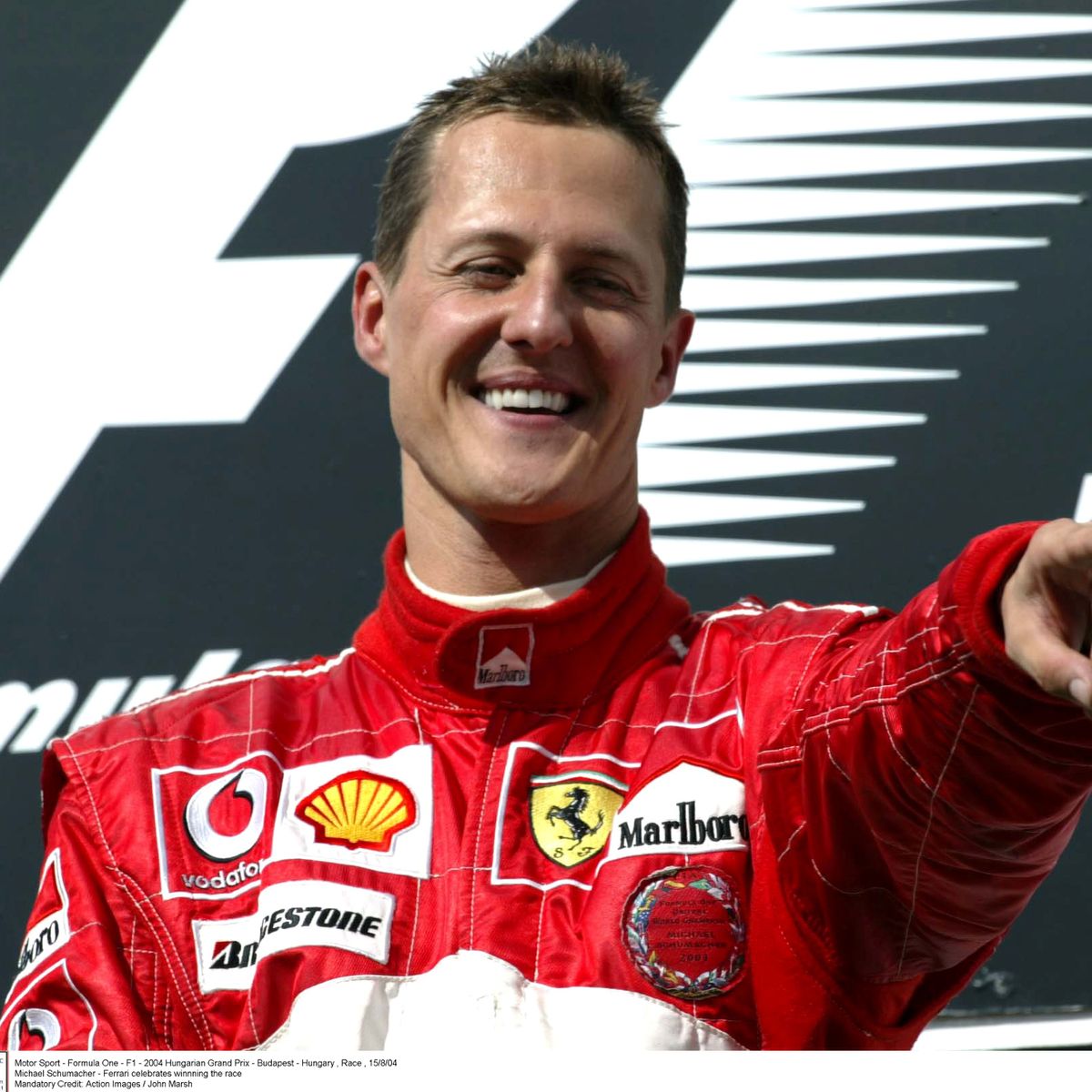 1 FILE PHOTO Michael Schumacher Ferrari celebrates winnning the race